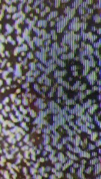 Close up view at a plasma tv while showing noise activity.
