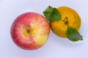 Apple and Orange Tangerine in an isoalted white background