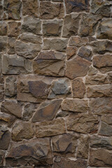 Vertical stone wall texture, masonry wall texture background, fragment of walls