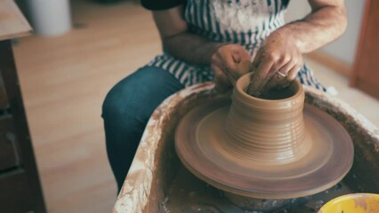 Hands, potter and pottery studio with worker, craftsmanship and clay in workshop. Small business, creative and expert for arts and crafts for artisan, employee and working on handmade art