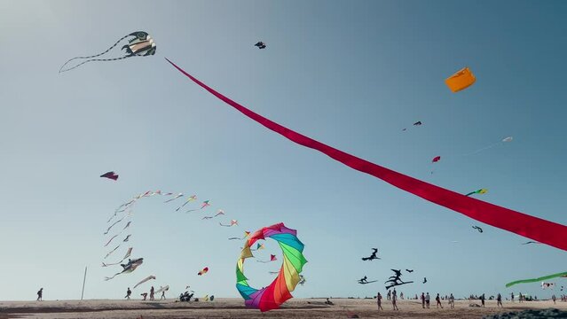 Colourful kites flying at the 2023 Kite Festival El Cotillo Fuerteventura