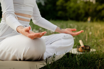 Closeup shot of open palms in meditating pose. Concept of peace and mindfulness. Fit yoga coach...