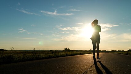 silhouette sports girl running along road sunset, runner training, triathlete running, cardio wellness, dedication concept determination, warming up before training, sport leisure fitness, young