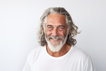 Smiling portrait of a bearded middle aged man on white background