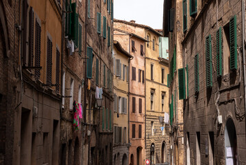 Fototapeta na wymiar Somewhere in the streets of the old medieval Siena city