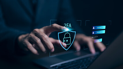 Privacy protect data and cybersecurity concepts. The two factor authentication laptop computer screen displays 2FA. Data protection with 2FA increases security. Log in with a username and password. - obrazy, fototapety, plakaty