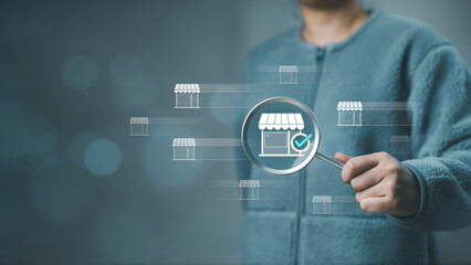 Woman using magnifying glass, find shop store for shopping online. E-commerce marketing business online. Internet Technology, online shopping, business delivery e-commerce, service on web. Purchase,