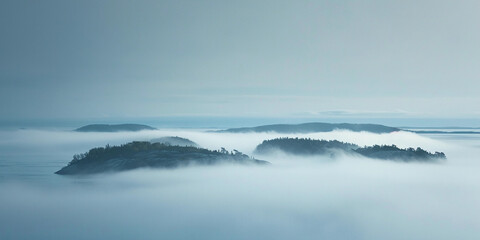 Fototapeta premium dense fog enveloping an archipelago, hauntingly beautiful, hints of islands emerging