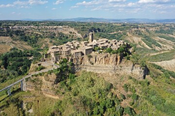Aerial view of Civita di Bagnoregio, medieval town on top of plateau in Viterbo province, Lazio, Italy - obrazy, fototapety, plakaty