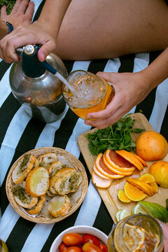 Outdoors picnic with vermut drink and fruit