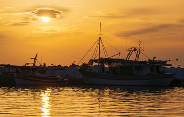 Fototapeta premium Sunset in the bay of the Aegean sea on the pier in Greece