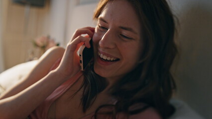 Excited female talking cell at home closeup. Cheerful woman hang up ending call