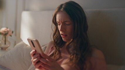 Upset girl reading bad news in smartphone closeup. Frustrated woman using mobile