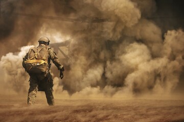 Military soldier running to helicopter in battlefield  - obrazy, fototapety, plakaty