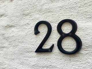 Close up of an house door number 28