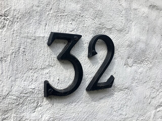 Close up of an house door number 32