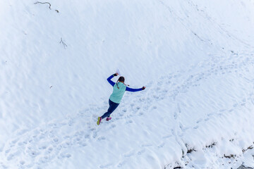 Young woman participates in winter orienteering training in urban conditions.