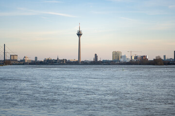Fototapeta na wymiar Düsseldorf Skyline with Rhine in the front while the flood