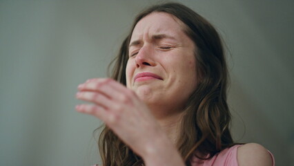 Closeup sad woman crying alone at night. Unhappy stressed girl grieving get bad