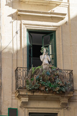 Balcony with a decorated mannequin - 705863903