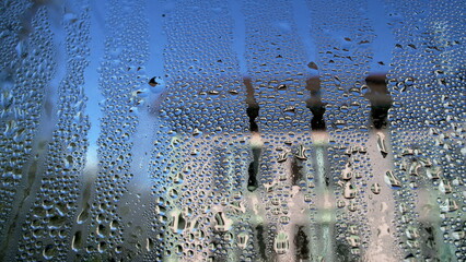 Droplets on home window caused by condensation during cold weather, macro wide angle