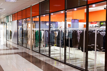 Children's and teenage fast-fashion clothing store window in shopping mall. shopping concept