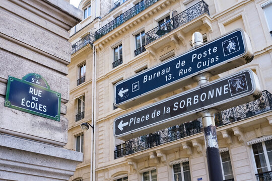 Signs to reach the Sorbonne, on Ecoles Street in Paris.