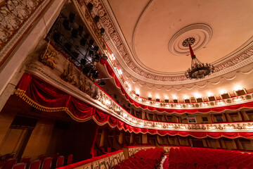 Old theatre stage auditorium. Empty comfortable chair interior. © Vadim