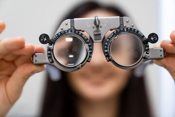 Optician eye correction glasses. Ophtalmologist clinic examining.