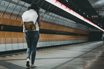 woman seen from behind on a metro station