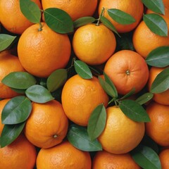 a pile of fresh oranges with leaves 