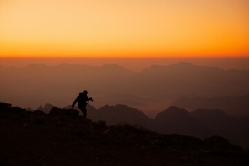 silhouette of a person in the mountains