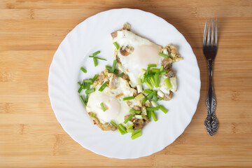 Cooking mushrooms with eggs and onions. Cooking at home. A series of photos.