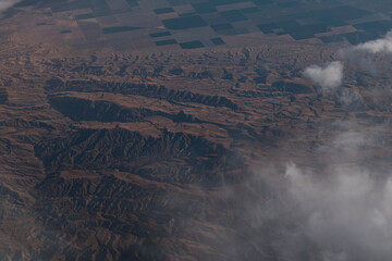 Aerial view of farms, fields and mountains in Mexico from a plane
