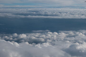 View of clouds from a airplane window at a sunny day