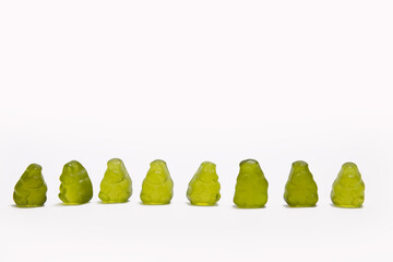 Green hippo gummy candy isolated on white 