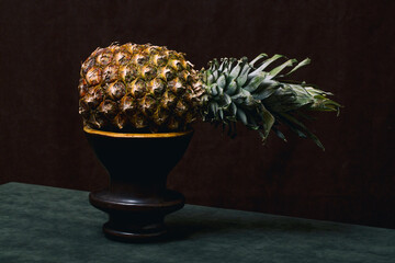 Ripe pineapple close-up on a dark background