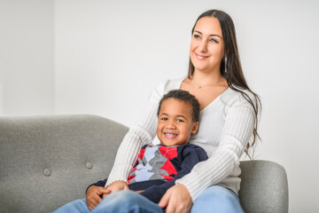 Fototapeta premium Mother with child son at home sofa