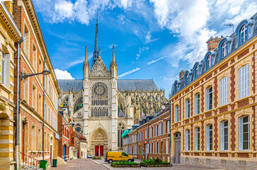 Amiens Cathedral Basilica of Our Lady Notre-Dame and pedestrian street with traditional buildings in old historical city centre, cityscape Amiens landmarks, Hauts-de-France Region, Northern France - obrazy, fototapety, plakaty