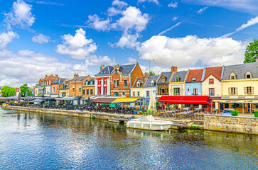Amiens cityscape old town Saint-Leu quarter, embankment promenade Quai Belu of Somme river water canal with street restaurants, typical buildings in historical city centre, Somme department, France © Aliaksandr