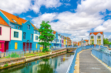 Colorful houses of Amiens historical city centre Saint-Leu quarter near water canal of Somme river....