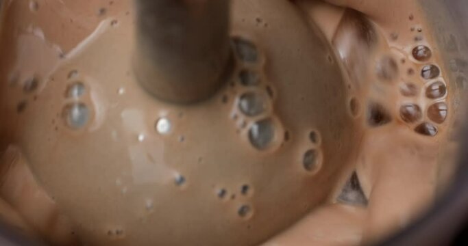 Mixing with blender cacao cocktail