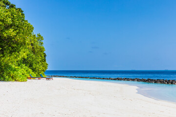 Azure water in the lagoon of the tropical island in the Maldives