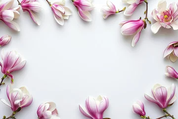 Fotobehang Frame with pink magnolia flowers on clear white background. Greeting card design for holiday, Mother's day, Easter, Valentine day. Spring holidays. Springtime composition with copy space. Flat lay com © dreamdes