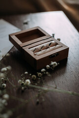 A wooden box with a key resting on top of it 5378.