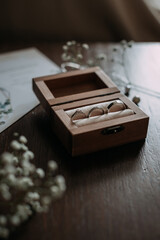 A wooden box with a key placed on a table 5379.