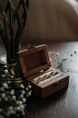 A wooden box with a key on top of it, placed on a table 5380.