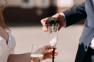 A person pouring a glass of wine 5400.