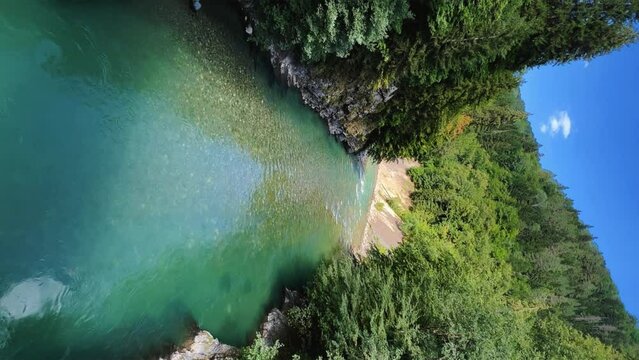 The Bolshaya Laba River. A mountain emerald river in a narrow, sunlit canyon. Bolshaya Laba River near the village of Psemen in Karachay-Cherkessia, Russia. Panoramic view. 4K