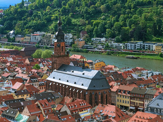 Church of the Holy Spirit in Heidelberg Old Town, Germany. View from the lower slope of Konigstuhl hill. The church was constructed between 1398 and 1515. - 705915588